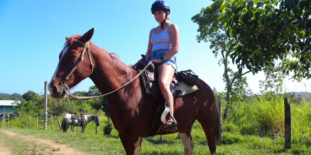 Young lady getting ready to horseback riding at San Lorenzo Farm